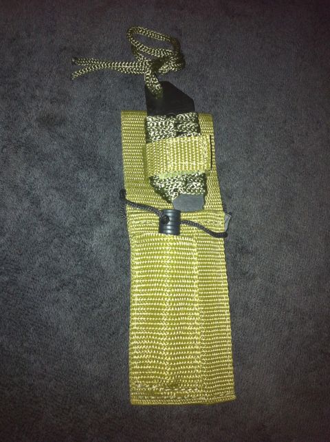 1984 BMW 3 Series - A close-up view of a tactical pouch with a decorative lanyard.