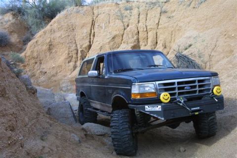 1994 Ford Bronco - This 1994 Ford Bronco navigates a rocky trail with a custom bumper and winch.