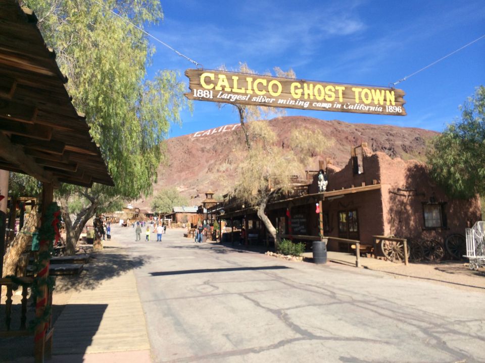 Calico Ghost Town sign with 1881 date, and historic buildings in California