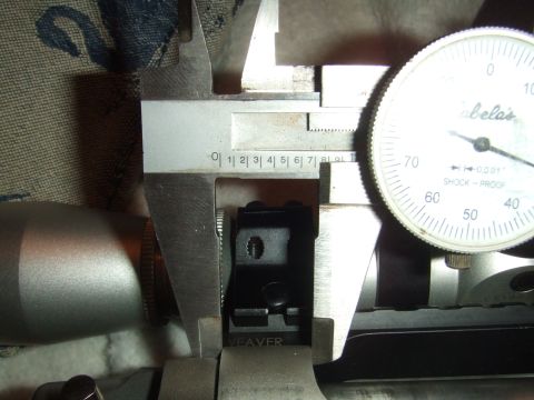 1996 Ford Bronco - Measuring a Weaver scope mount base with calipers and a dial indicator.