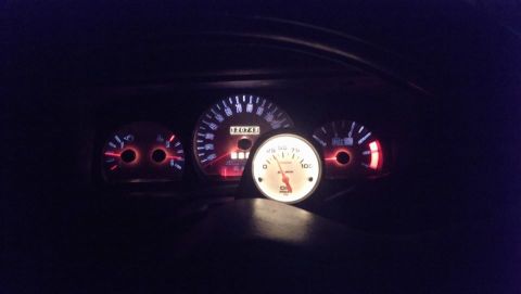 2000 Mercury Grand Marquis - The illuminated dashboard gauges show an odometer reading of 126743.