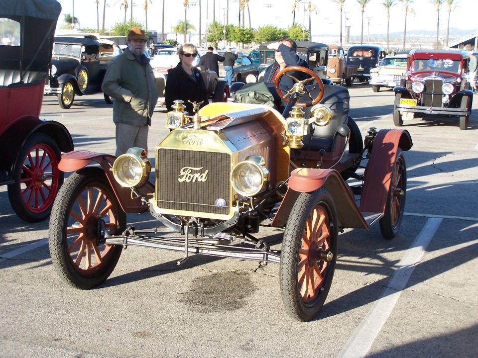 Antique Ford car with brass grille and wooden wheels