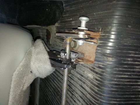 1995 Ford Bronco - Seat adjustment mechanism with metal components and foam padding visible.