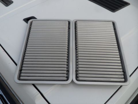 1994 Jeep Cherokee - Two air cleaner housings are shown, each with a ribbed metal design and a silver-colored frame.