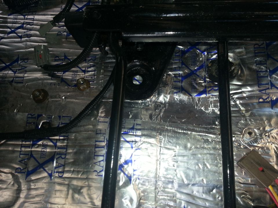 Seat mounting bracket and wiring with sound deadening material