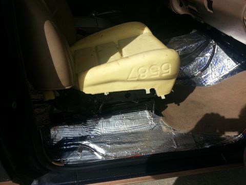 1994 Ford Bronco - Car seat foam with molded numbers 4999. Insulation is installed on the floor.