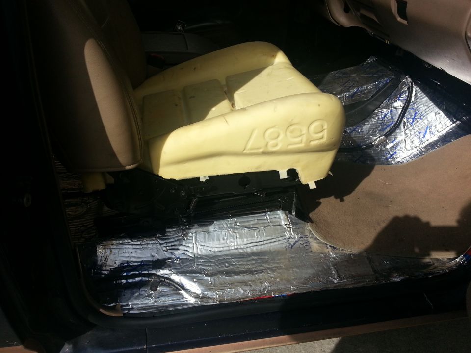Car seat foam with numbers 4999 visible, insulation on floor
