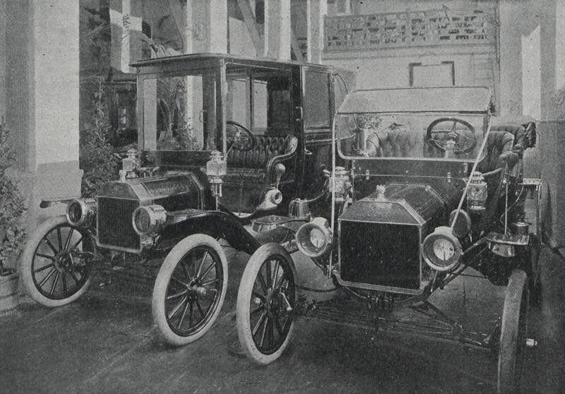 1912 Ford Model T town car and another early automobile side-by-side