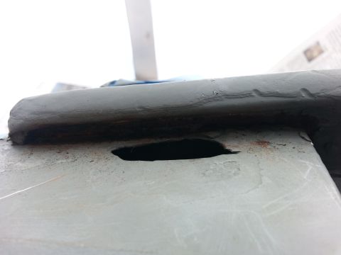 1992 Ford Bronco - passenger hole below the drip rail. It had rusted all the way through so I had to cut to clean metal to repair. this was after it had been…