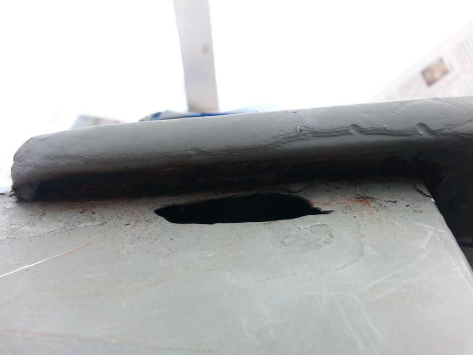passenger hole below the drip rail. It had rusted all the way through so I had to cut to clean metal to repair. this was after it had been primed.