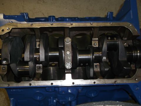 1967 Ford Mustang - Close-up view of an engine's internal components, including the crankshaft and connecting rods.