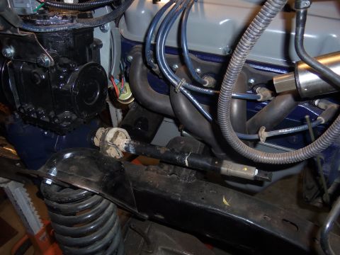 1968 Ford Bronco - Engine bay detail showing steering components and exhaust manifold.