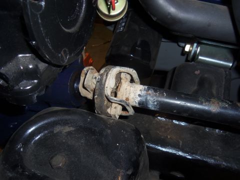 1968 Ford Bronco - This image shows a close-up view of a vehicle's steering shaft universal joint, which appears to be rusty and worn.