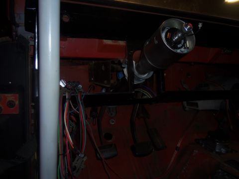 1968 Ford Bronco - Vehicle interior showing a steering column assembly and a complex wiring harness.