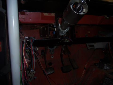 1968 Ford Bronco - The image shows the interior of a vehicle, focusing on the steering column and a complex wiring harness.