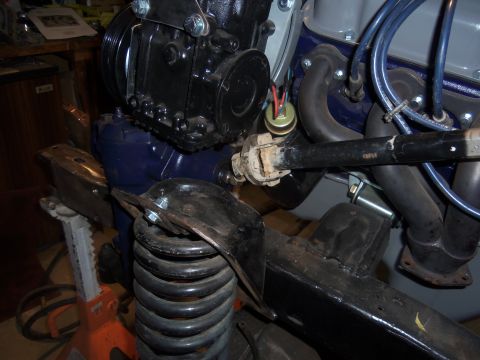 1968 Ford Bronco - Close-up view of engine and suspension parts, possibly during a repair or upgrade.