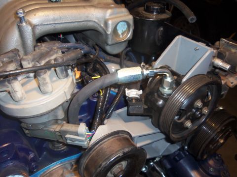 1968 Ford Bronco - Close-up view of engine components, focusing on the power steering system and distributor.