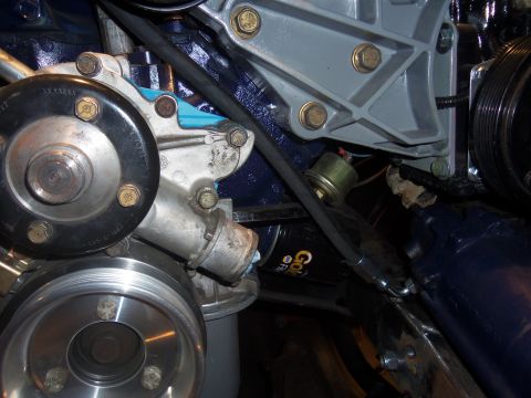 1968 Ford Bronco - Detail shot of engine components, focusing on the water pump and associated hardware.