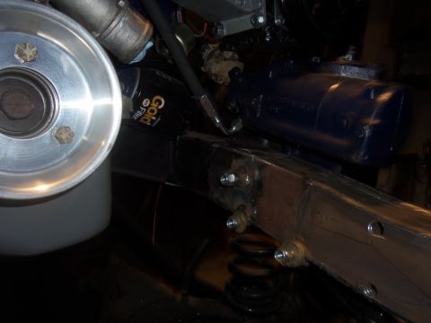 1968 Ford Bronco - Engine and chassis components, including a pulley and oil filter, are shown in this close-up view.