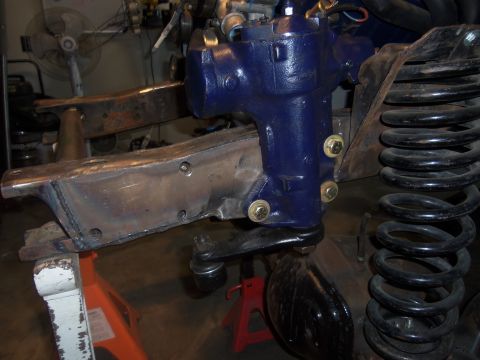 1968 Ford Bronco - Close-up view of a vehicle's steering and suspension system, likely undergoing modification or repair.