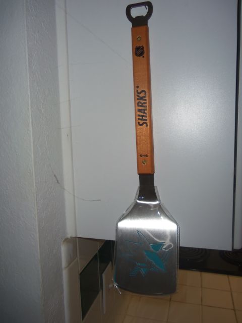 1968 Ford Bronco - A grill spatula with a bottle opener and the Sharks logo is shown.