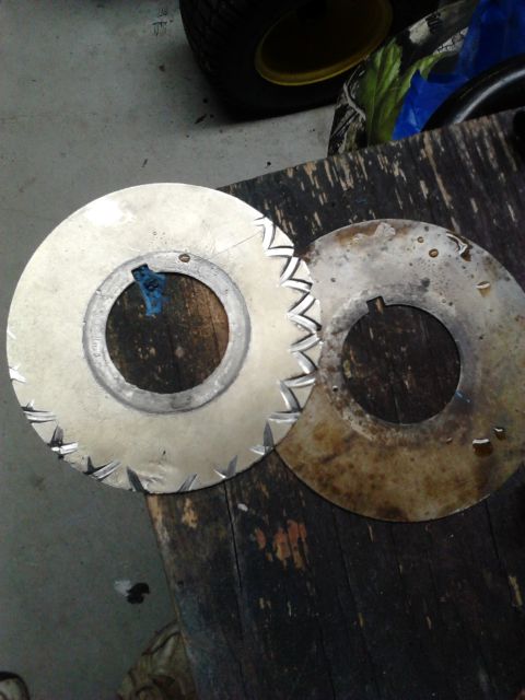 1979 Ford Ranchero - Two serrated metal discs, possibly cutting blades, are shown on a wooden workbench.