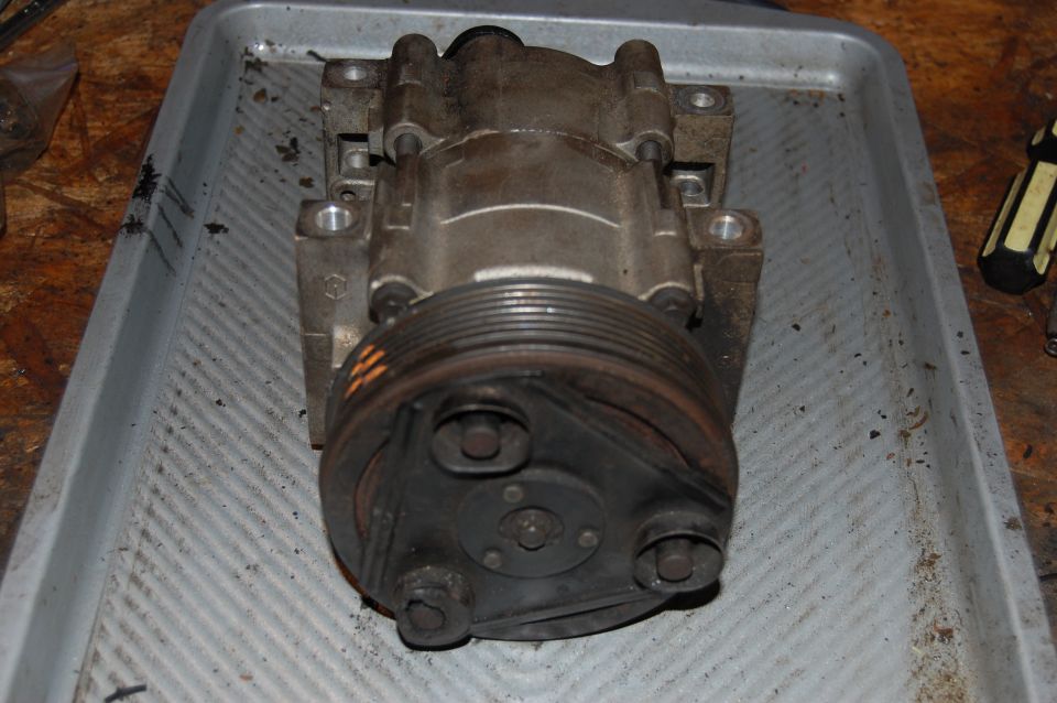 Ford FS 10 Ac compressor removed from a 1994 ford bronco. This compressor seized without warning in stop and go traffic.
The engine continued to drive the clutch after it seized, ruining it and overheating to the point that the rubber isolators caught fire. A electric radiator fan was installed but not on at the time. suspected failure was overheating from excessive head pressure.