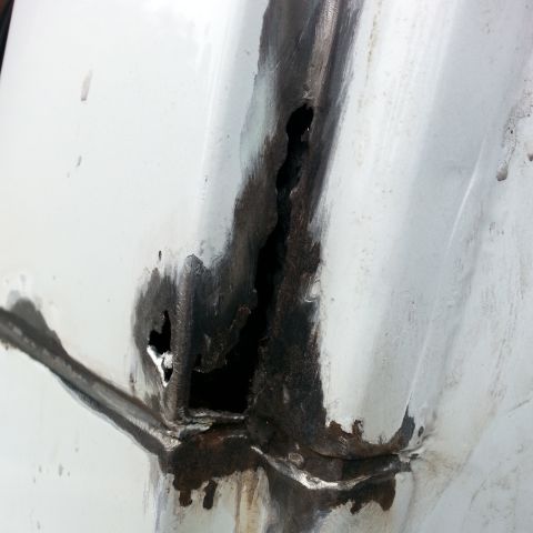 1992 Ford Bronco - this area around the seam in the pillar was bad. going to need to do some cutting to get to clean metal so I can repair it.