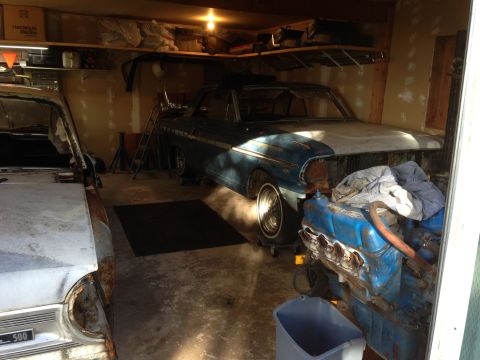 1964 Ford Fairlane - A blue 1964 Ford Fairlane sits in a garage, its front end disassembled, with an engine block in the foreground.