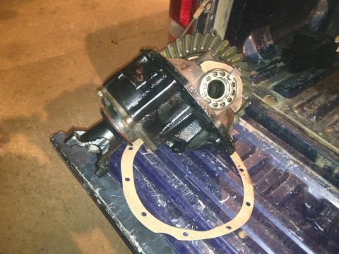 1970 Ford F-250 - A differential assembly and its gasket are shown, likely removed from a vehicle for repair or replacement.