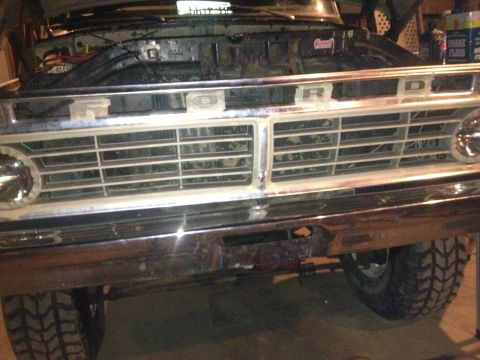 1970 Ford F-250 - Front view of a 1970 Ford F-250 truck, showing its grille, chrome bumper, and off-road tires.