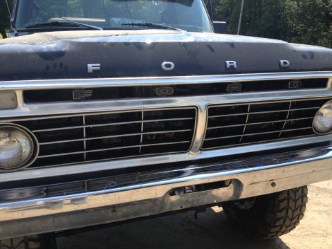 1970 Ford F-250 - Close-up of a Ford truck's front end, highlighting the grille and hood lettering.