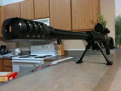 2013 Ford Mustang - A sniper rifle rests on a kitchen counter, positioned in front of a stove and cabinets.