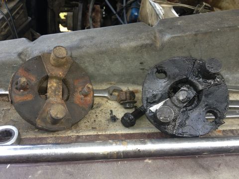 1970 Ford F-250 - Comparison of a worn steering coupler with a new one, showing rust and grease buildup.