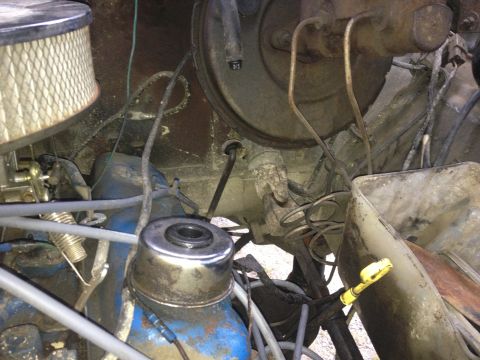 1970 Ford F-250 - A detailed view of engine components, including the air filter and brake booster assembly.