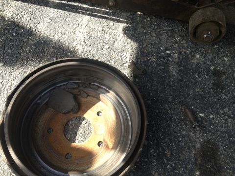 1970 Ford F-250 - This brake drum shows significant wear and damage to the brake shoe material.