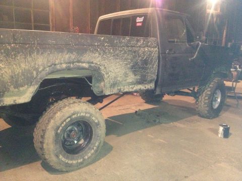 1970 Ford F-250 - This 1970 Ford F-250 pickup truck is shown from the side, covered in mud and a lifted suspension.