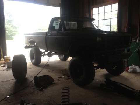 1970 Ford F-250 - This 1970 Ford F-250 pickup truck is undergoing modifications in a garage setting.