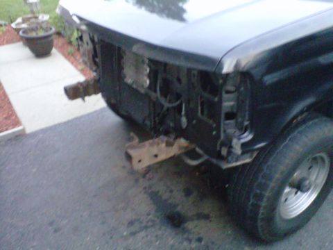 1994 Ford Bronco - Front view of a black 1994 Ford Bronco showing damage and missing bumper.