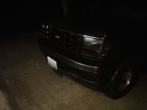 1994 Ford Bronco - Front view of a 1994 Ford Bronco at night.