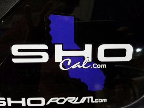 1993 Ford Taurus - Decals for SHO Cal.com and SHOFORUM.com are visible on a black surface.