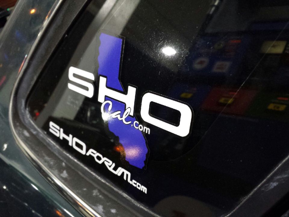 Car window with SHO Cal.com and SHOFORUM.com stickers