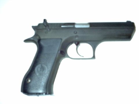 1995 Ford Bronco - A black pistol is shown from the side against a white background.