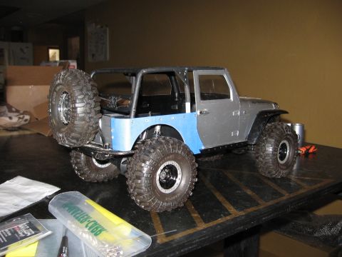 1993 Toyota 4Runner - Remote control Jeep Wrangler model with custom paint and off-road tires sits on a table.
