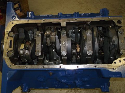 1967 Ford Mustang - Close-up view of an engine block's internal components, including the crankshaft and connecting rods.