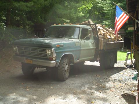 1979 Ford Bronco - This Ford F-Series truck, likely from the late 1960s, is carrying a load of firewood.