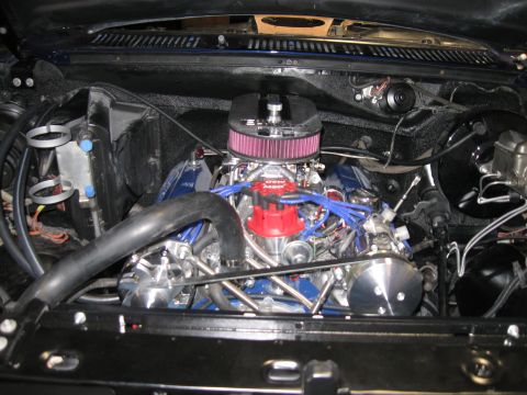 1982 Ford Bronco - Close-up view of a V8 engine, likely modified, in an engine bay.