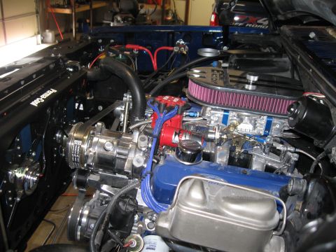 1982 Ford Bronco - Close-up view of a modified engine bay a supercharger and custom components.