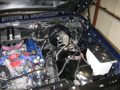 1982 Ford Bronco - Customized engine bay aftermarket performance parts and a blue paint scheme.
