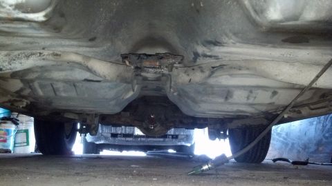 1985 Mercury Grand Marquis - The underside of a vehicle is shown, revealing the differential and exhaust components.